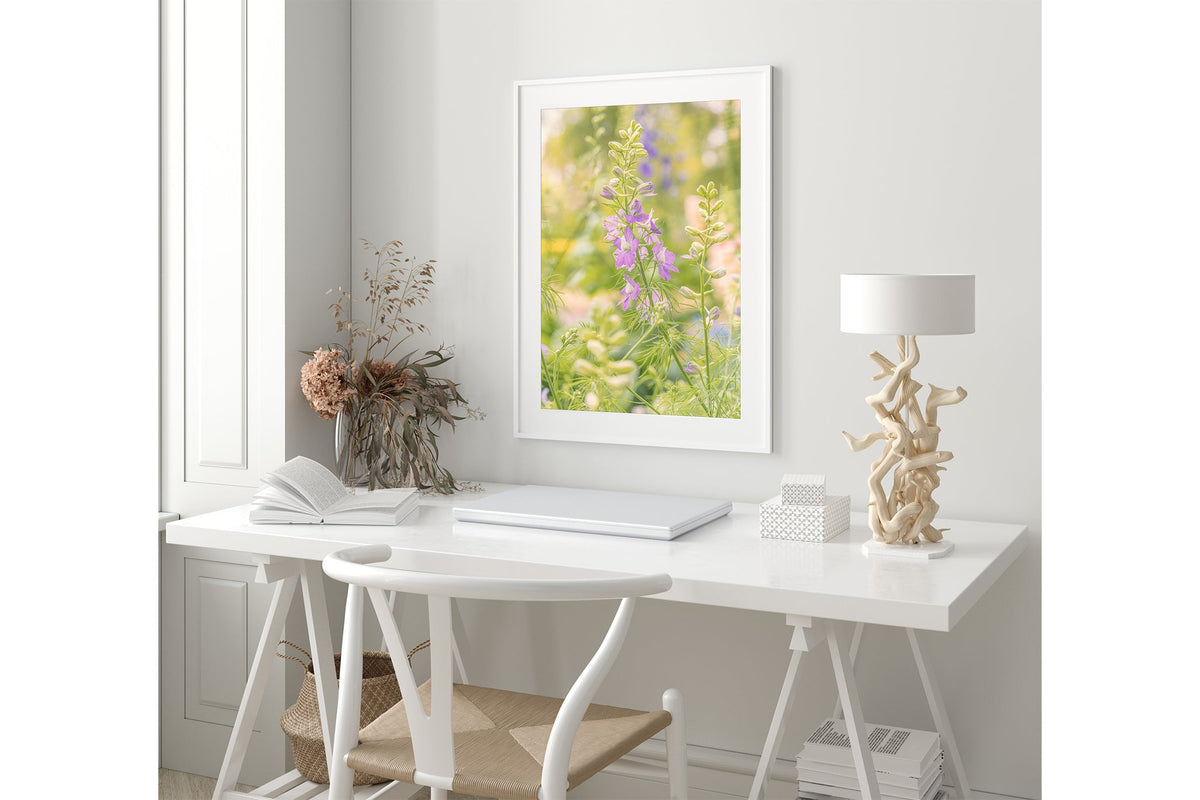 Glowing larkspur print shown framed in white.