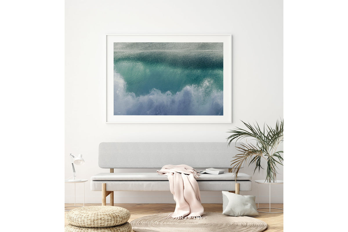 Aqua wave print shown framed in white above a bench seat.