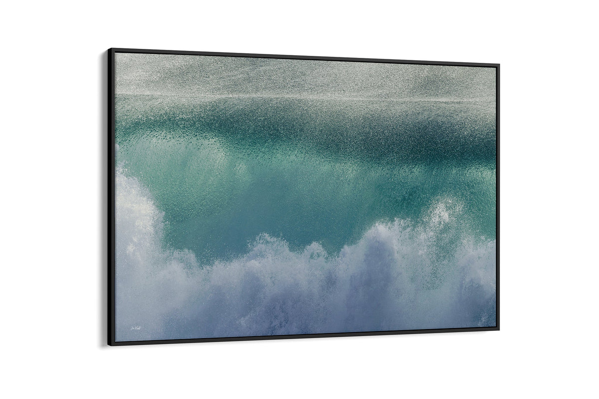 Aqua wave print shown as a canvas in a black float frame.