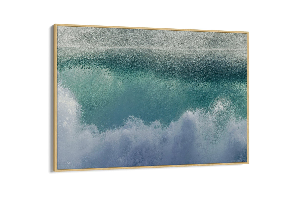 Aqua wave print shown as a canvas in an oak float frame.