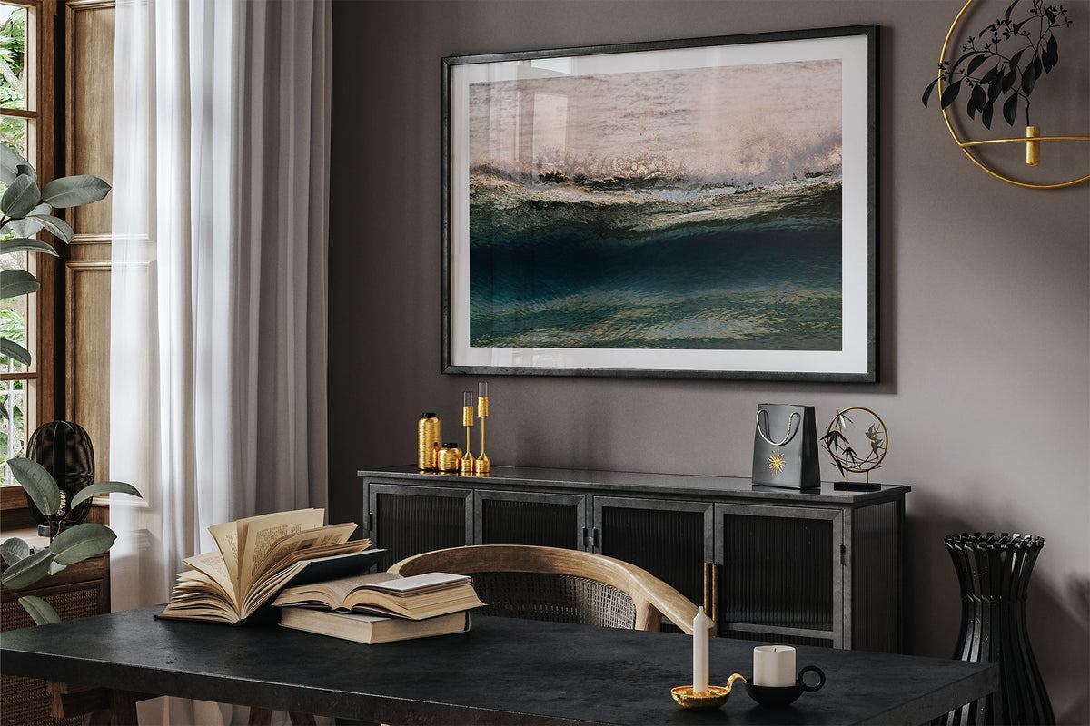 Rose Crest print shown framed in black in a dark room.