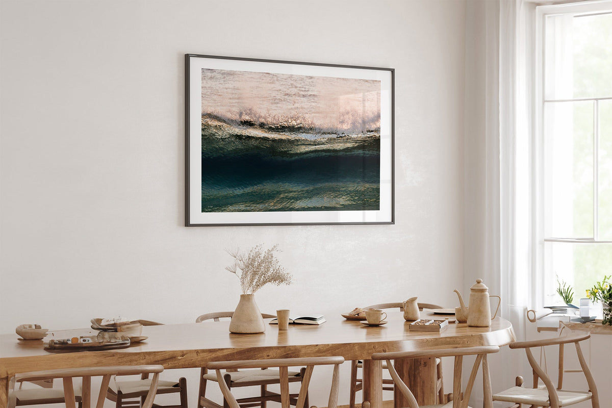 Rose Crest print shown framed in black above an oak table.