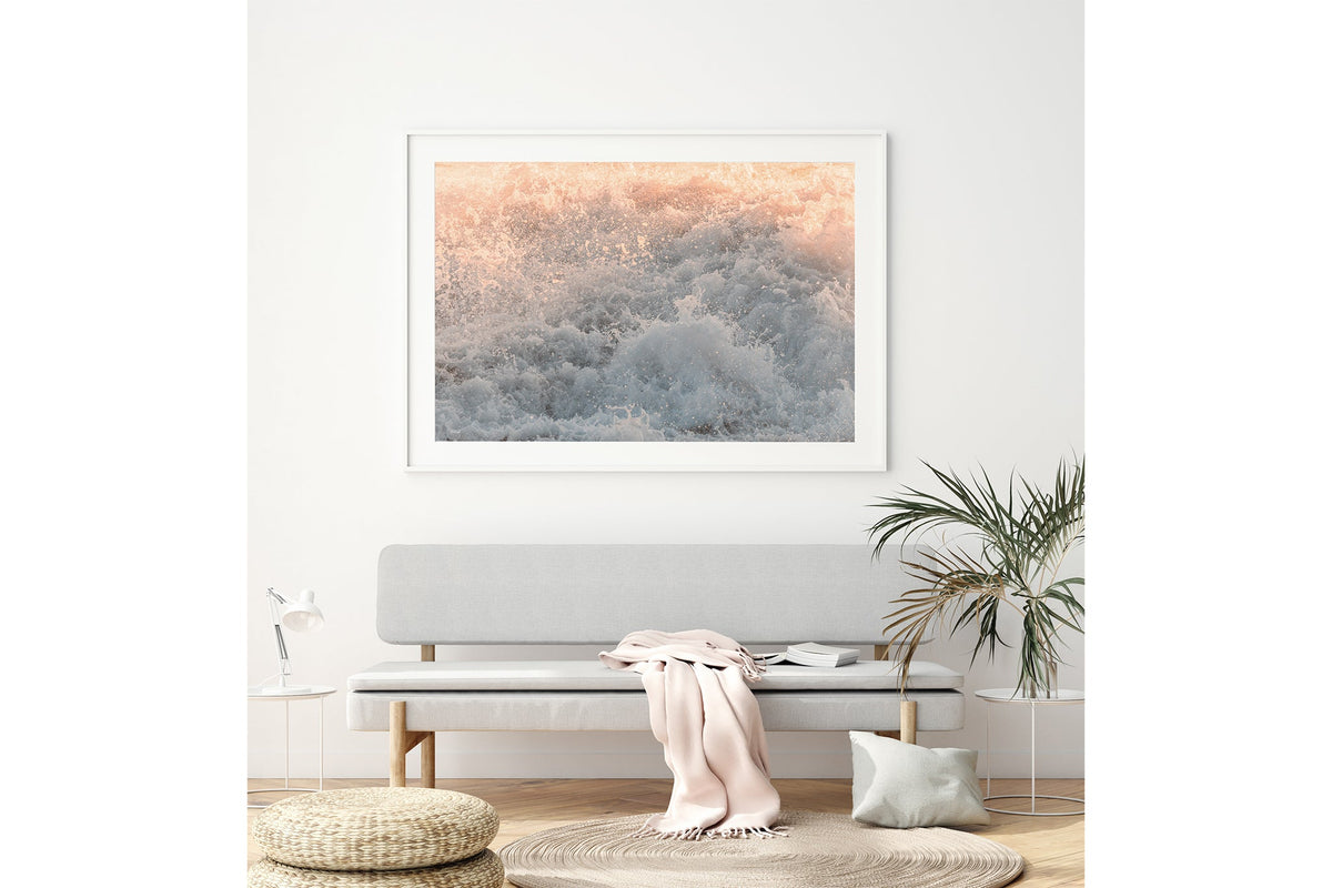 Peach Spray print shown framed in white above a bench seat.