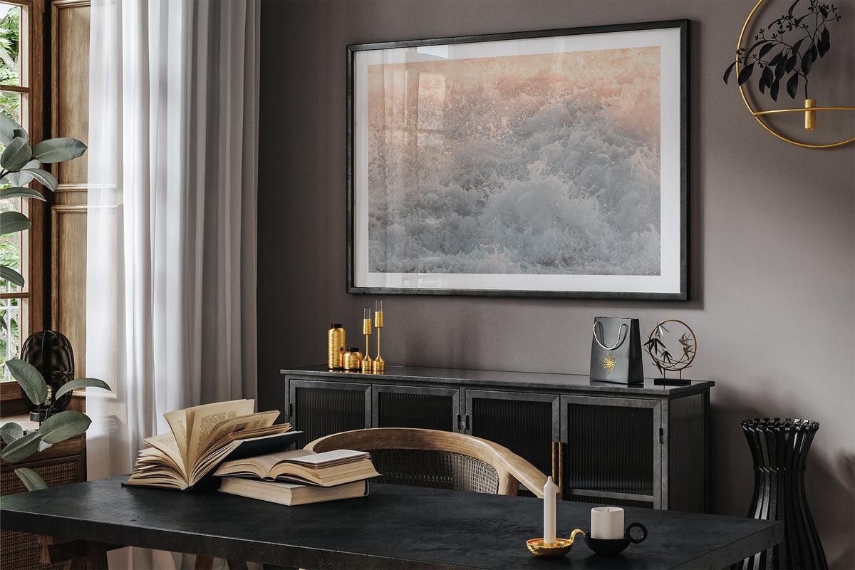 Peach Spray print shown framed in black in a dark room.