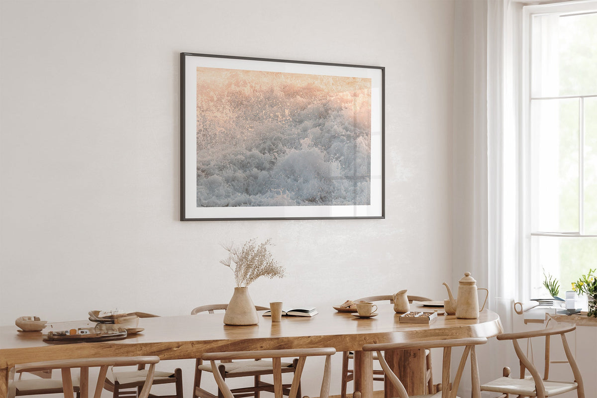 Peach Spray print shown framed in black above an oak table.