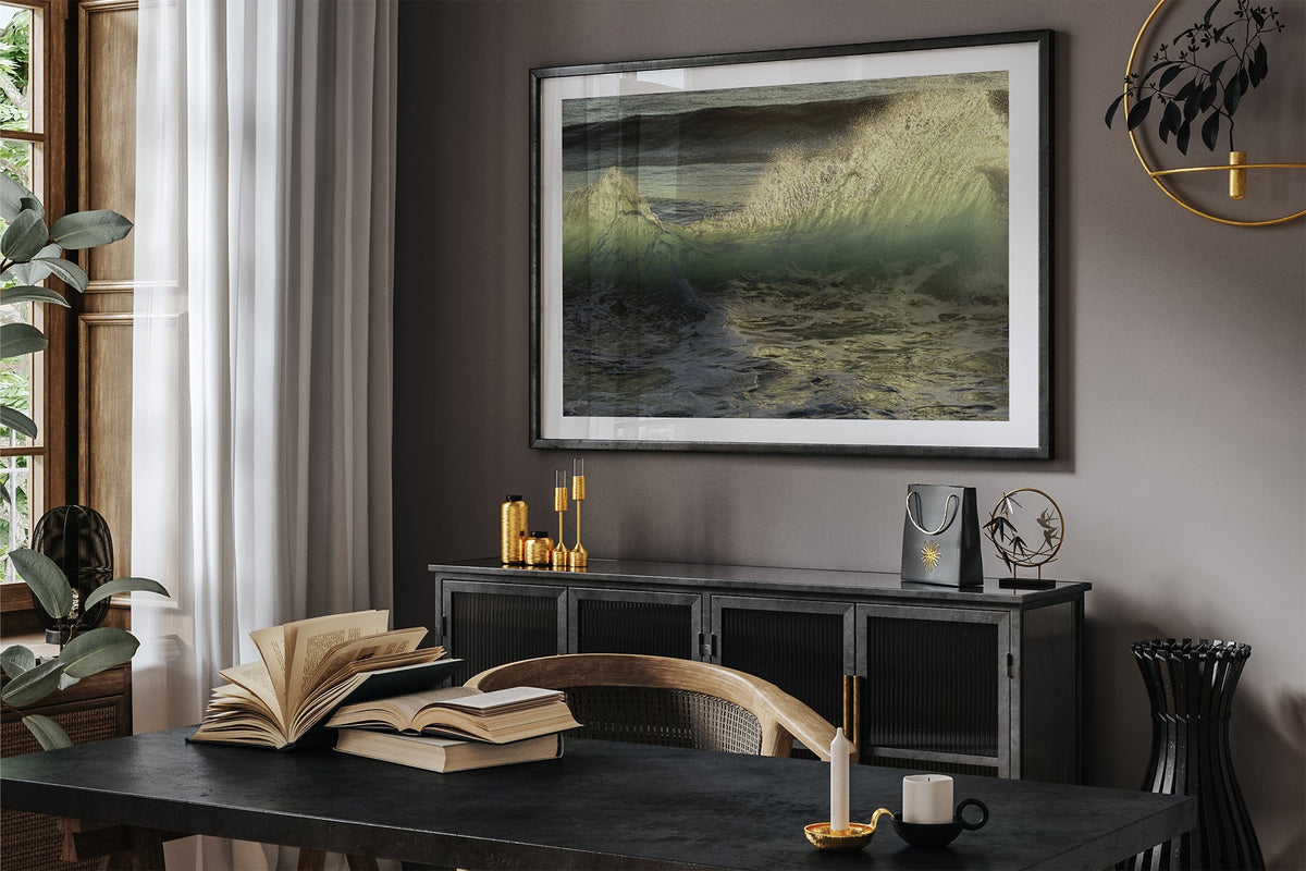 Emerald Crest print shown framed in black in a dark room.