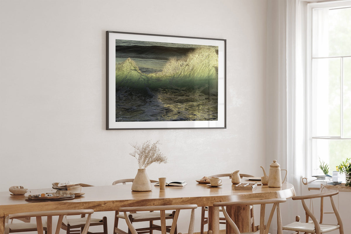Emerald Crest print shown framed in black above an oak table.