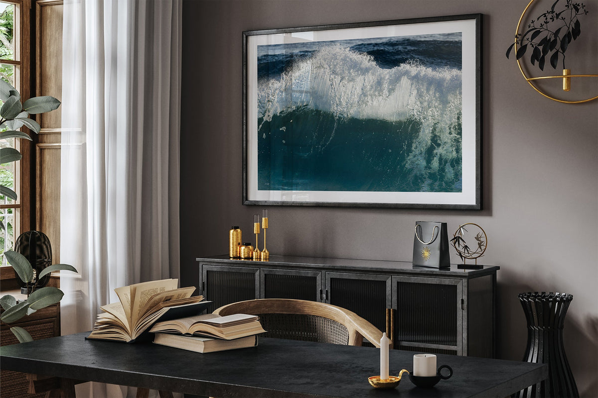Glacier Crest print shown framed in black in a dark room.
