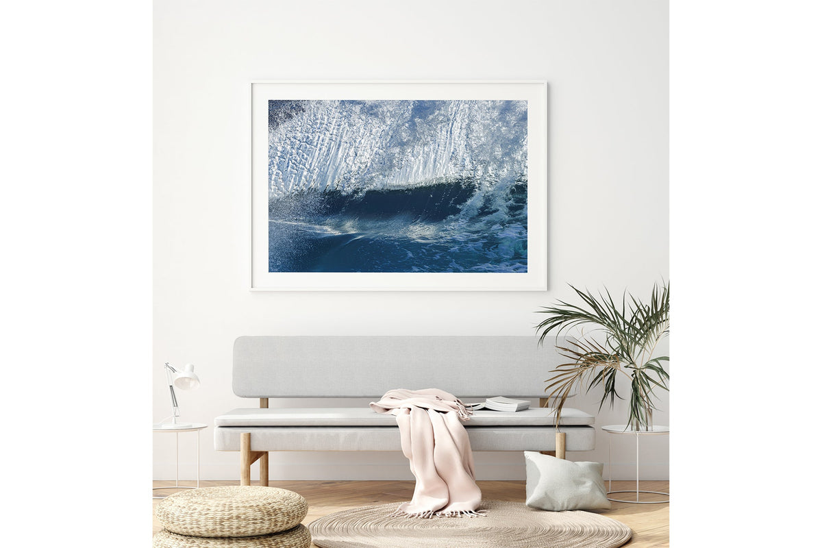 Ice Cascade print shown framed in white above a bench seat.