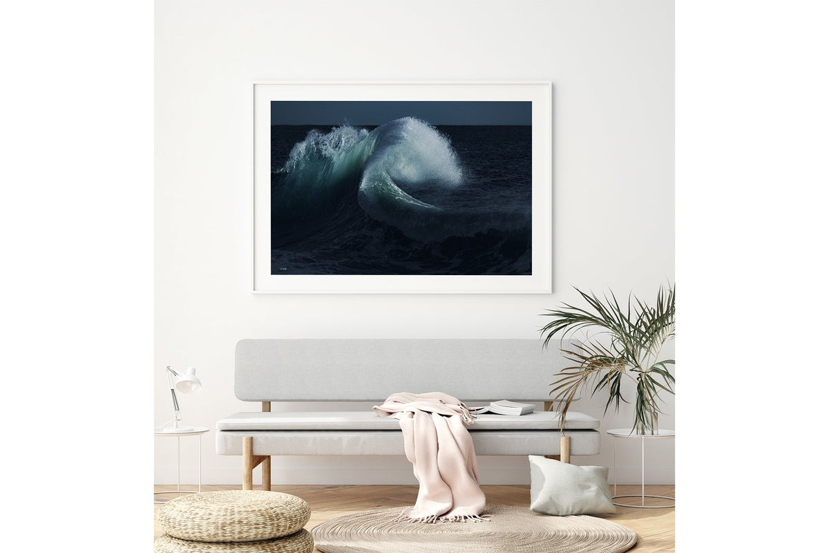 Moonlit Curl print shown framed in white above a bench seat.