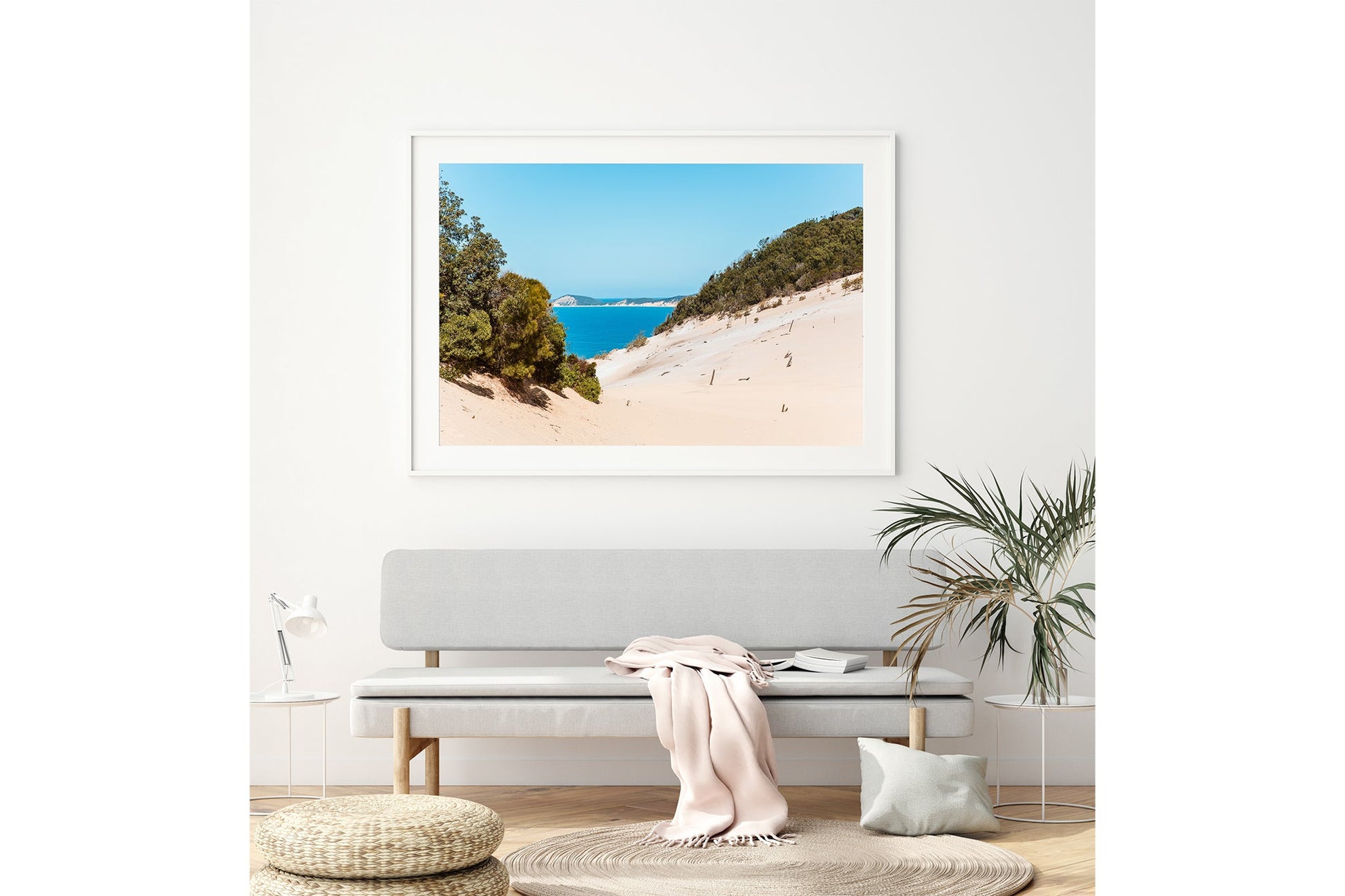 Rainbow Beach dune print shown framed in white above a bench seat.