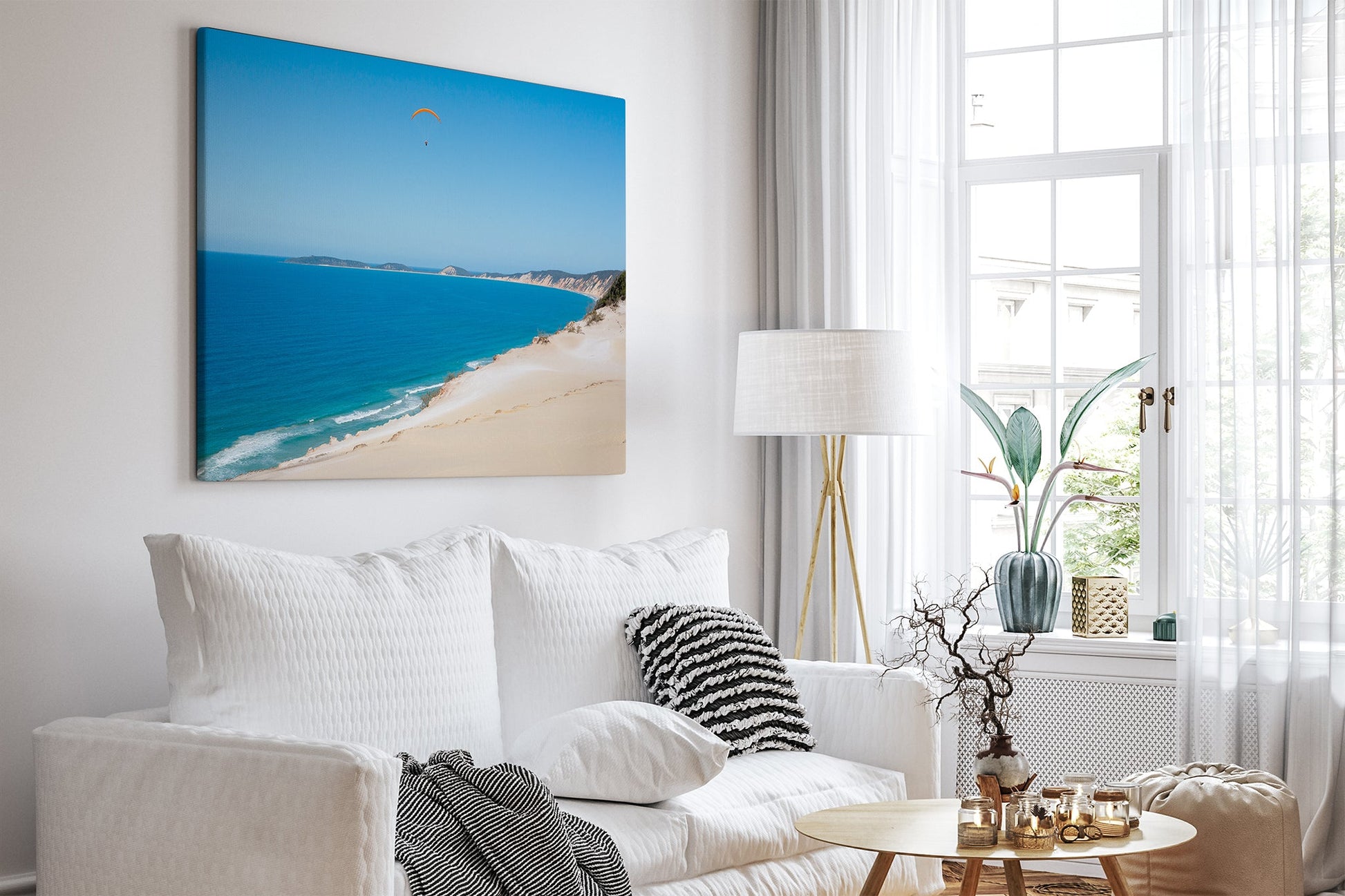 Rainbow Beach paraglider print shown as a canvas in a bright white living room.