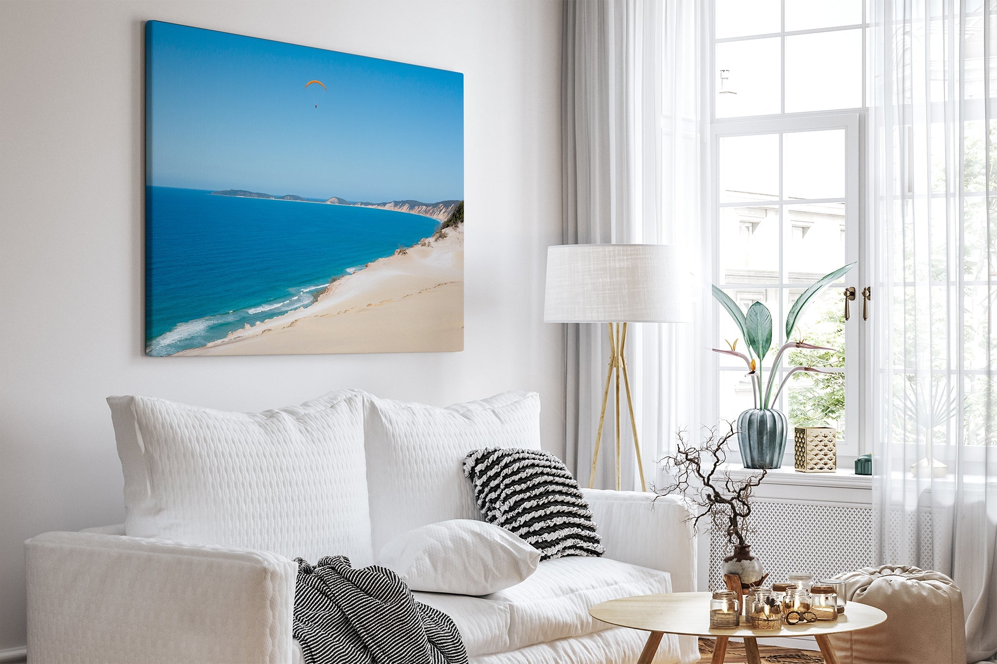 Rainbow Beach paraglider print shown as a canvas in a bright white living room.