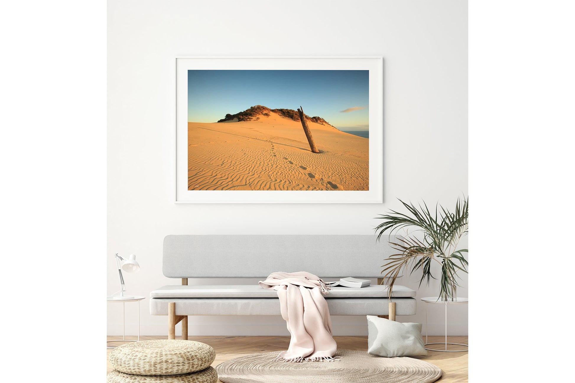Rainbow Beach dune print shown framed in white above a bench seat.