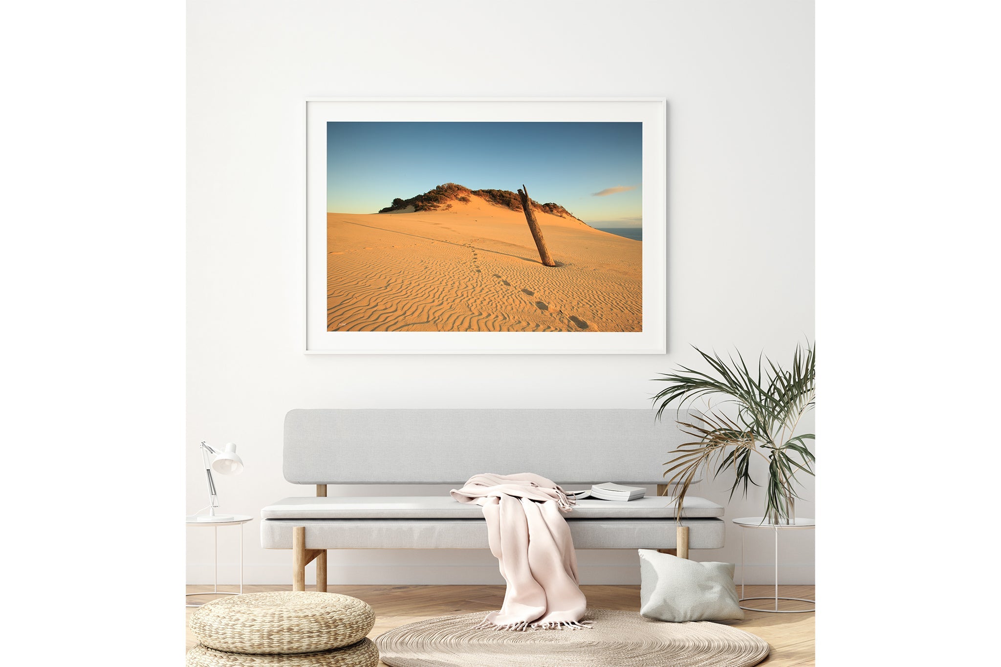 Rainbow Beach dune print shown framed in white above a bench seat.