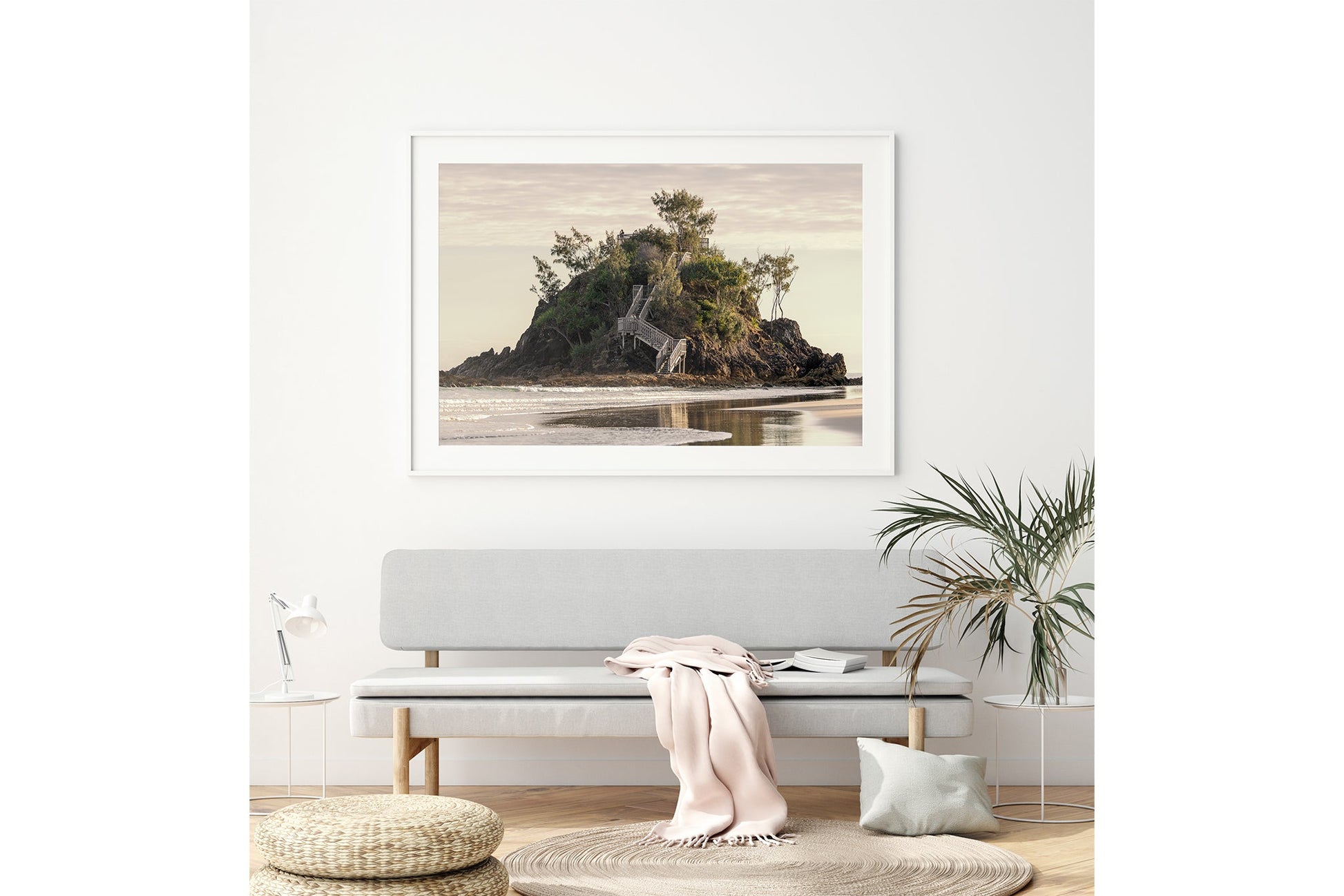 Golden Headland print shown framed in white above a bench seat.