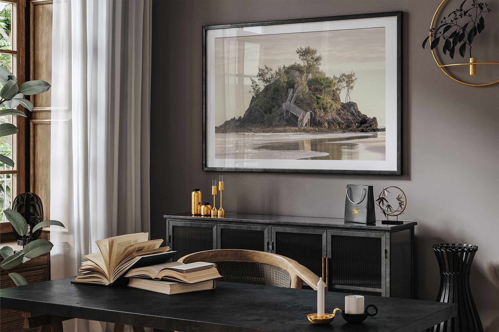 Golden Headland print shown framed in black in a dark toned room.