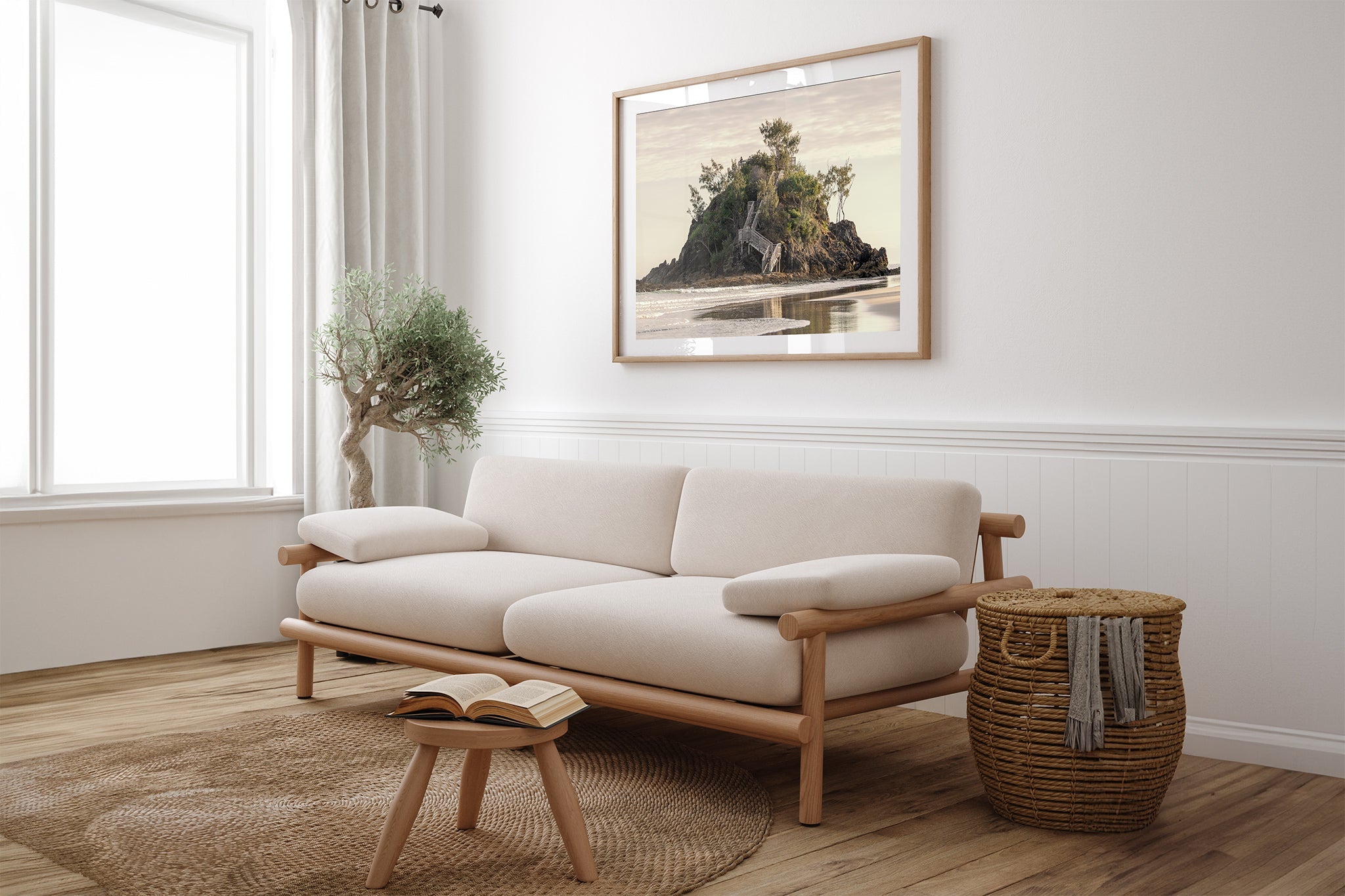 Golden Headland print shown framed in oak above a couch.
