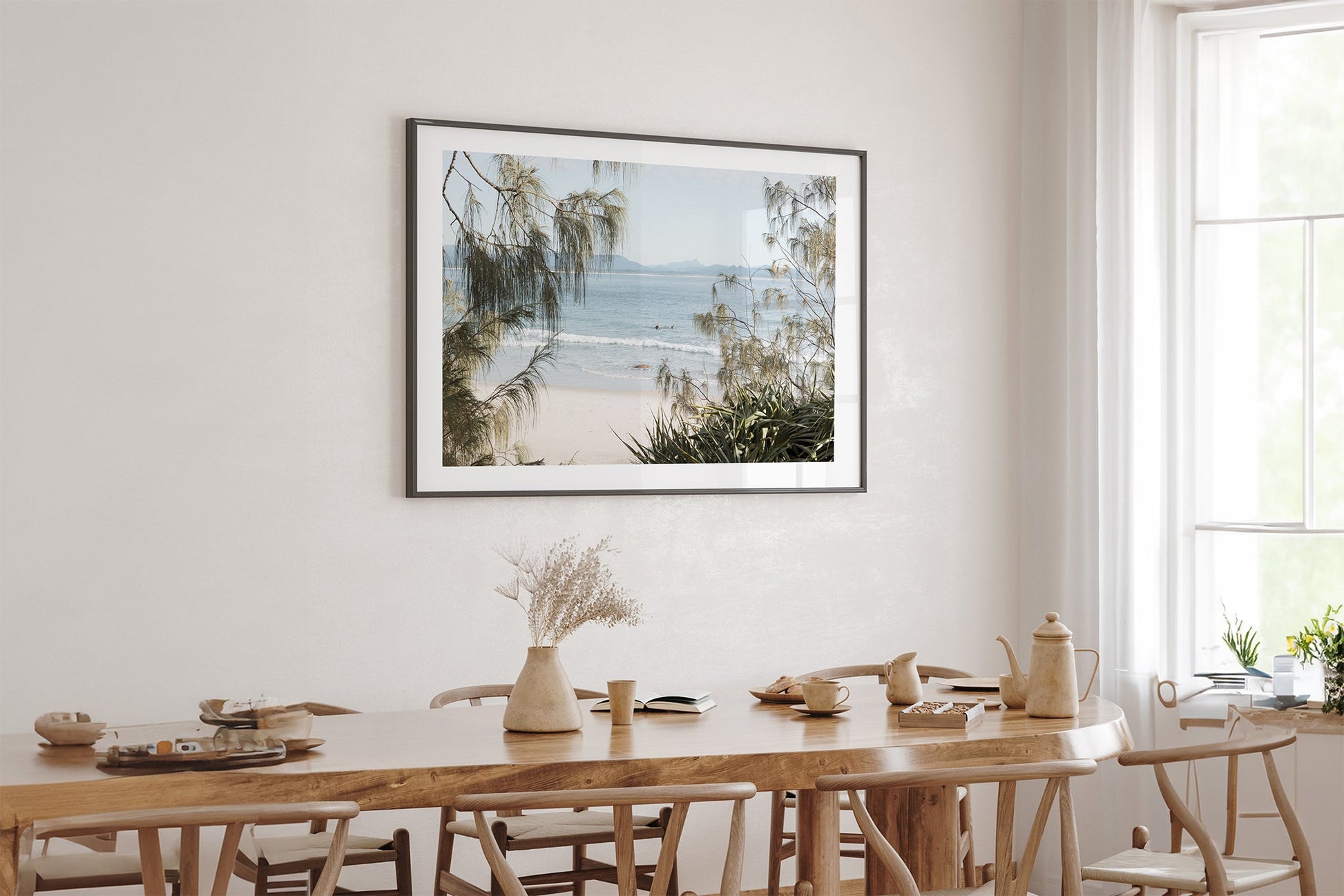 Hinterland Horizon print shown framed in black above an oak table.