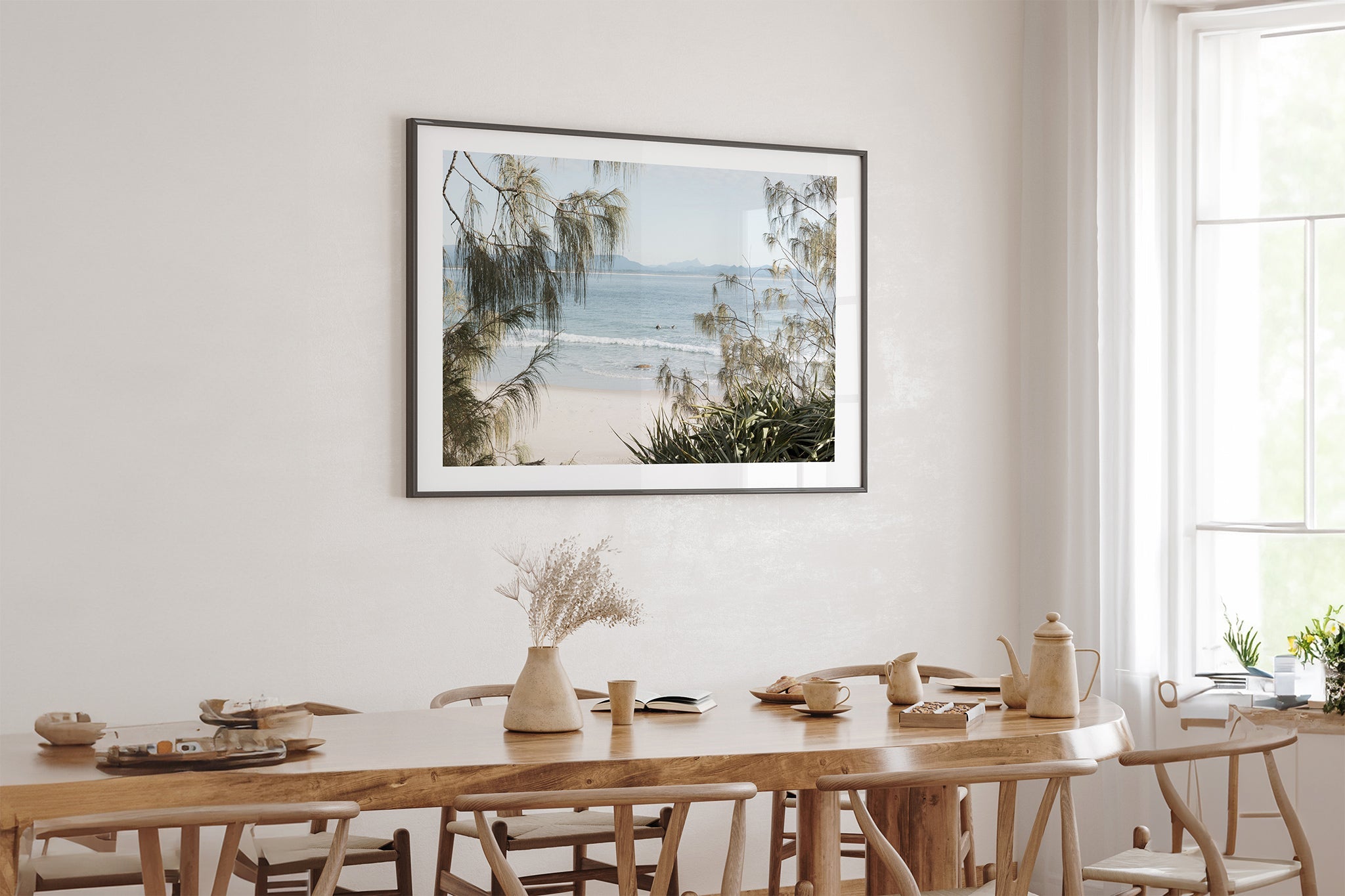 Hinterland Horizon print shown framed in black above an oak table.