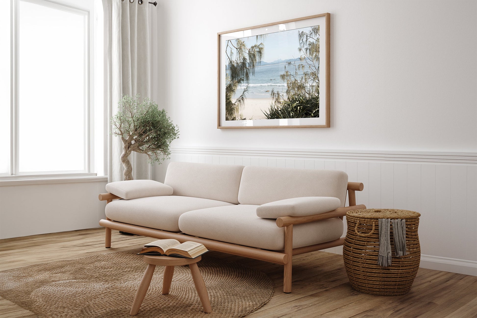 Hinterland Horizon print shown framed in oak above a couch.