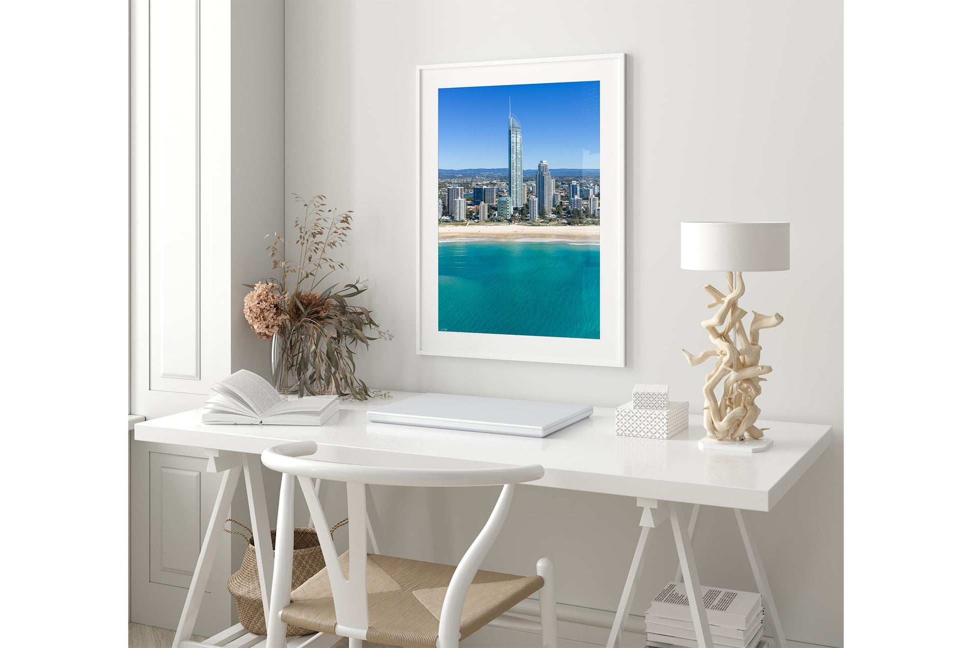 The Coastal Heights print shown framed in white in a coastal-styled room.