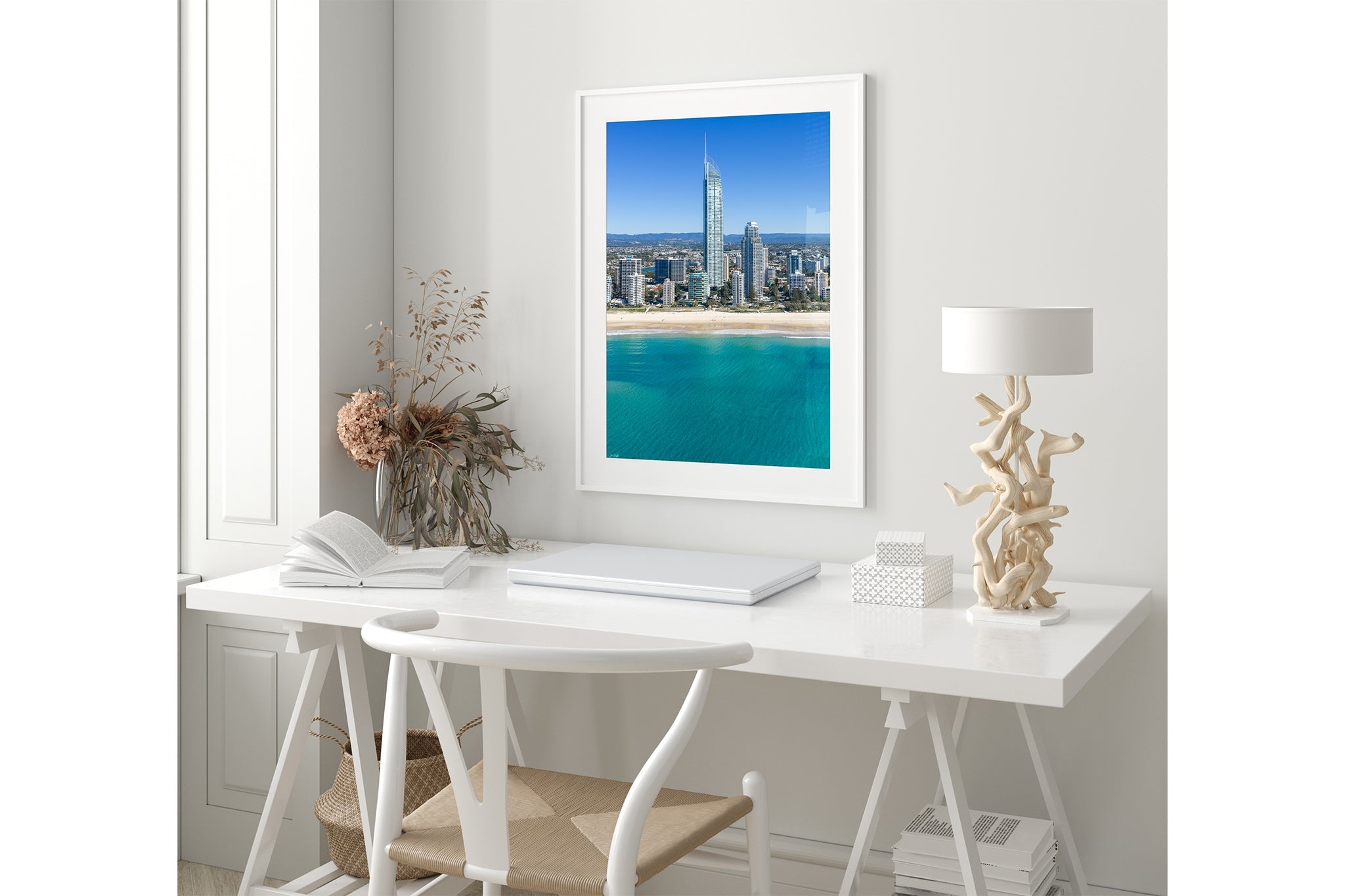 The Coastal Heights print shown framed in white in a coastal-styled room.