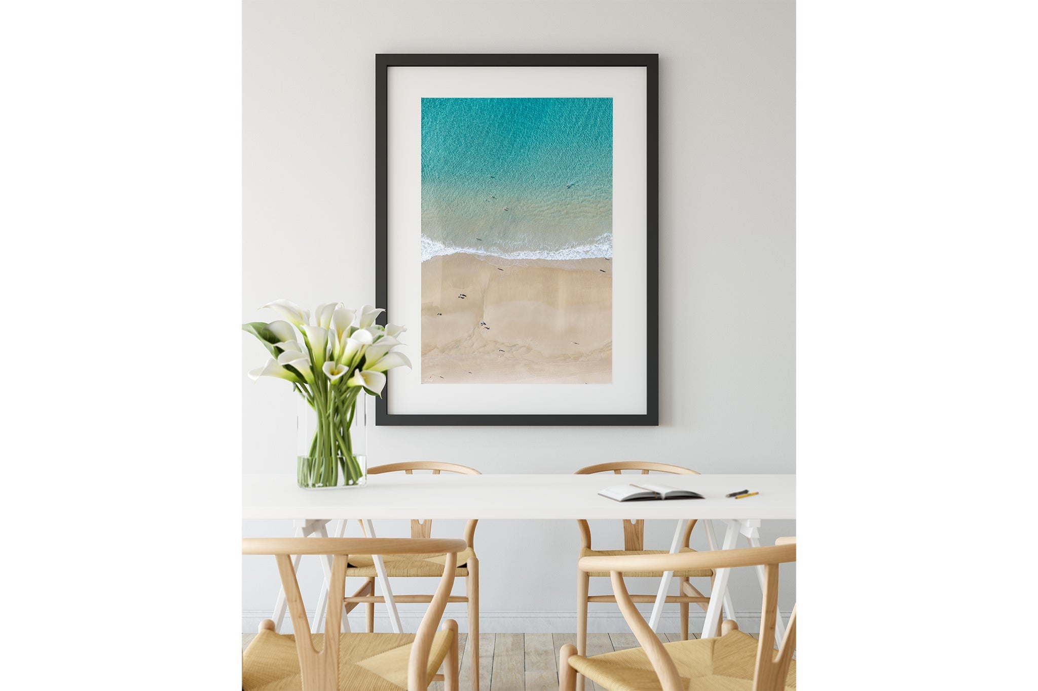 The Turquoise Shallows print shown framed in black.