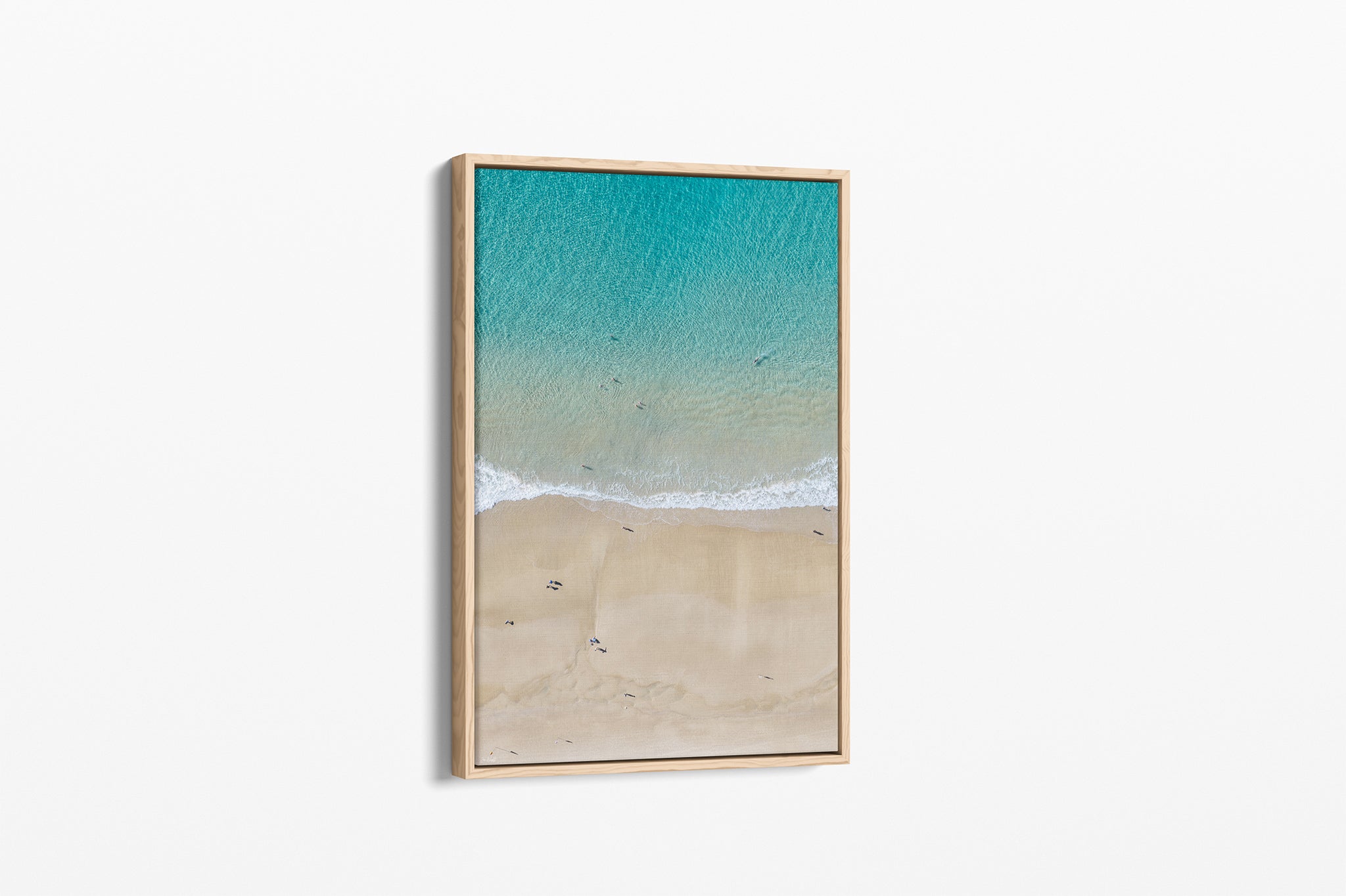 The Turquoise Shallows print shown as an oak float-frame canvas.
