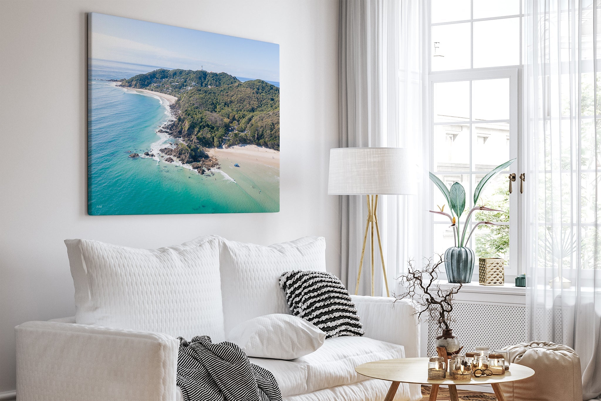 Cape Byron aerial print shown as a canvas in a white room.