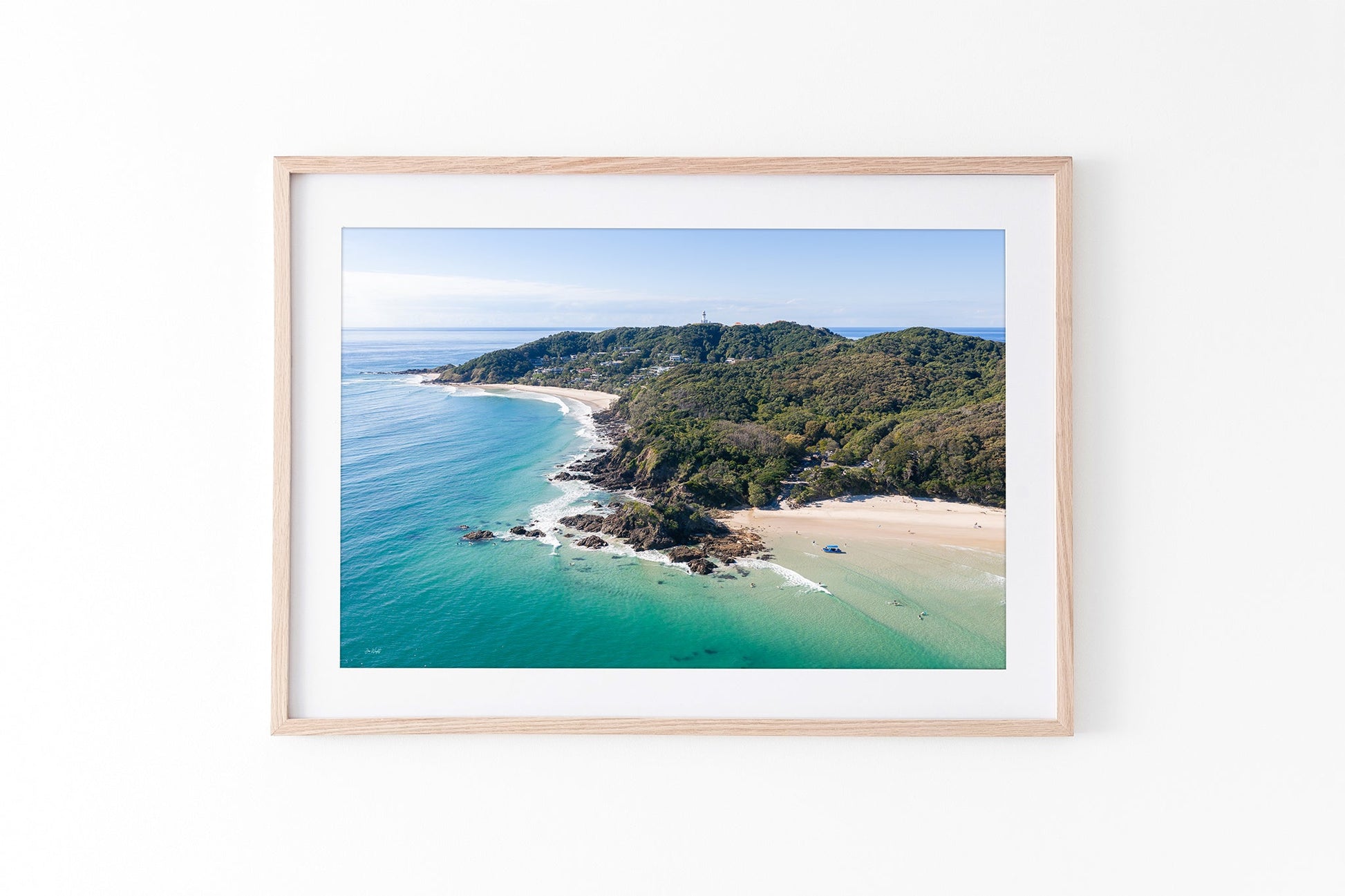 Cape Byron aerial print shown framed in oak.