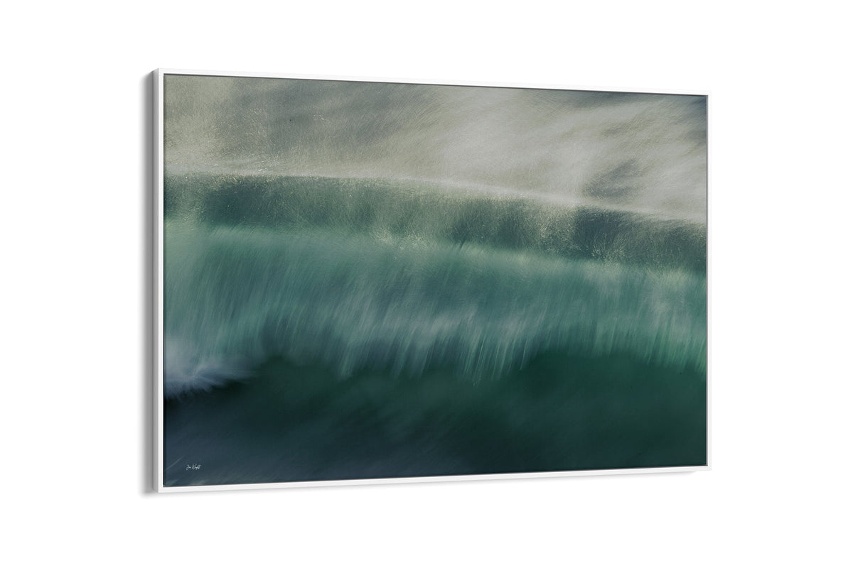 Glistening Spray wave print shown as a canvas in a white float frame.