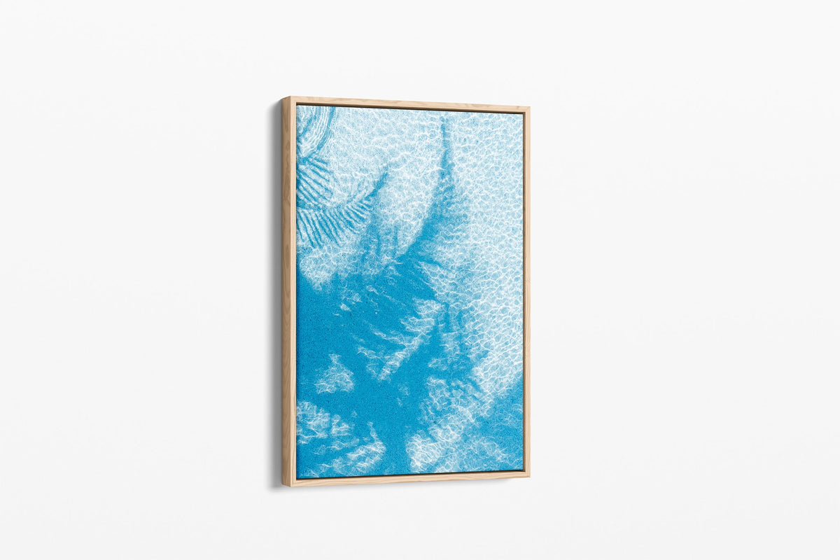 Pool Palms print shown as a canvas in an oak float frame.