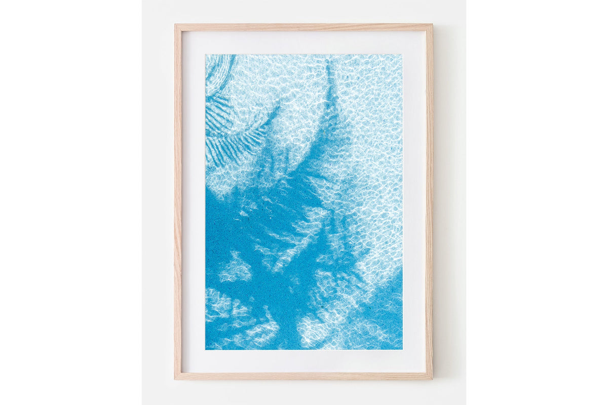 Pool Palms print shown framed in oak with a white mat.