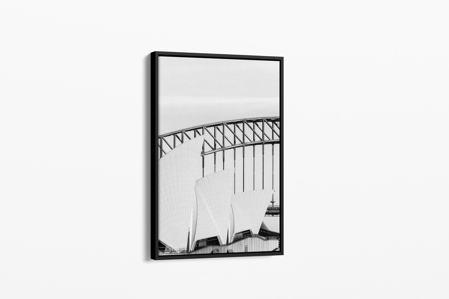 Framed black and white photograph of a bridge on a white background