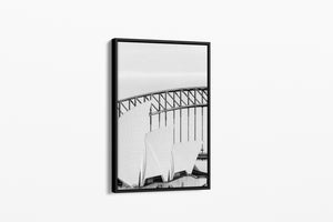 Framed black and white photograph of a bridge on a white background
