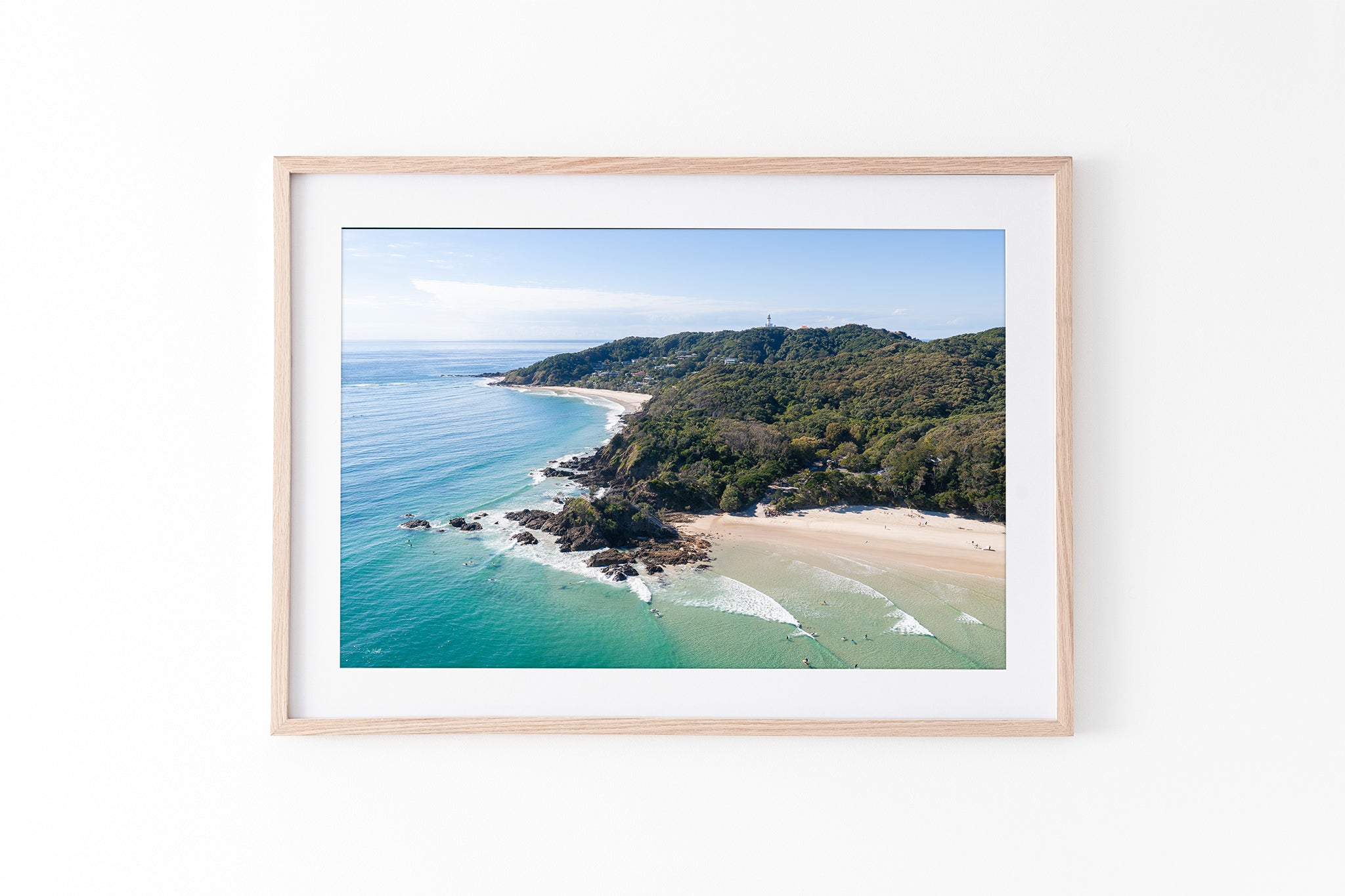 Lighthouse Point print shown framed in oak.