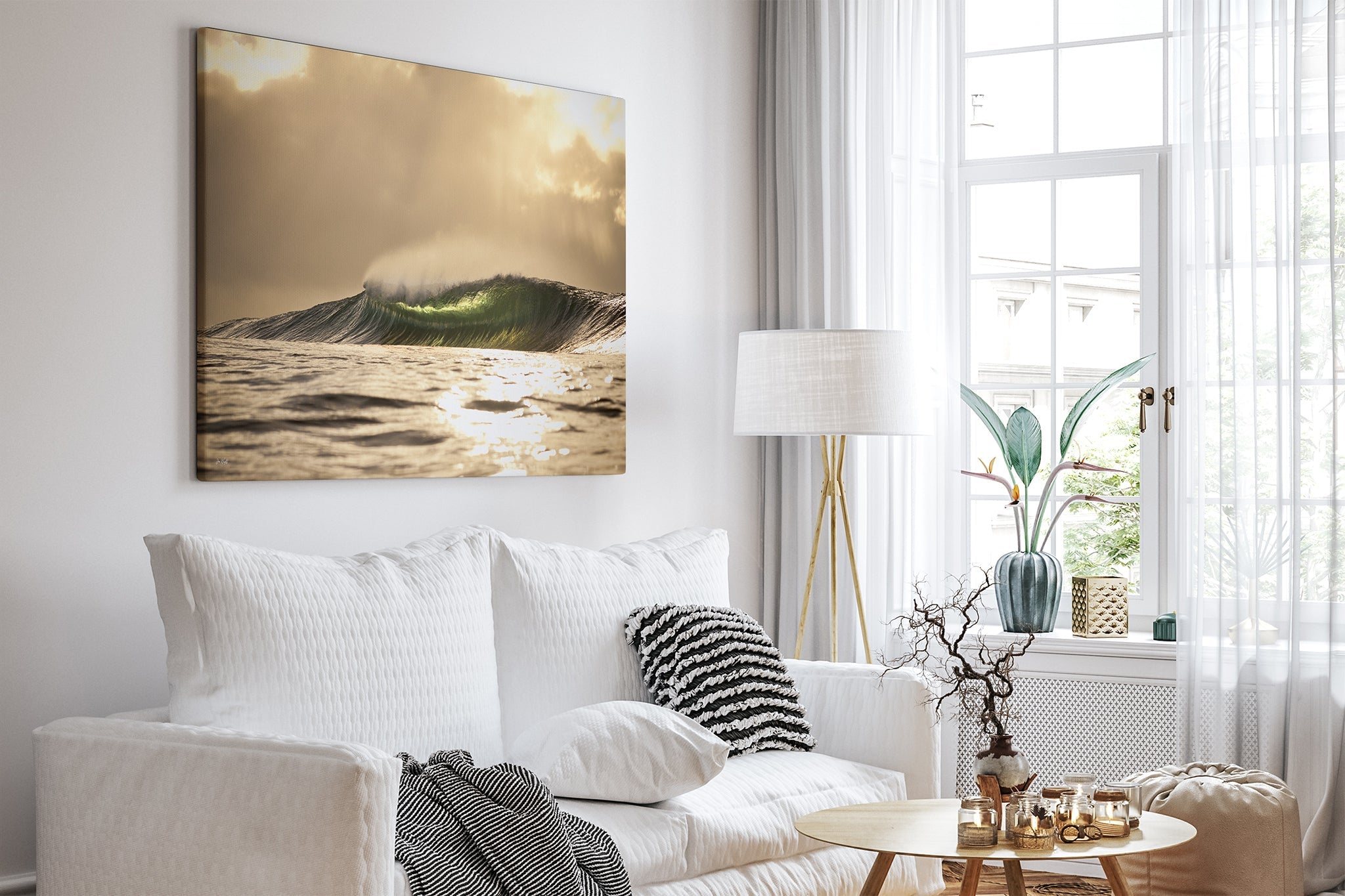 Golden sunset wave print shown as an unframed canvas, hung in a bright white living room.