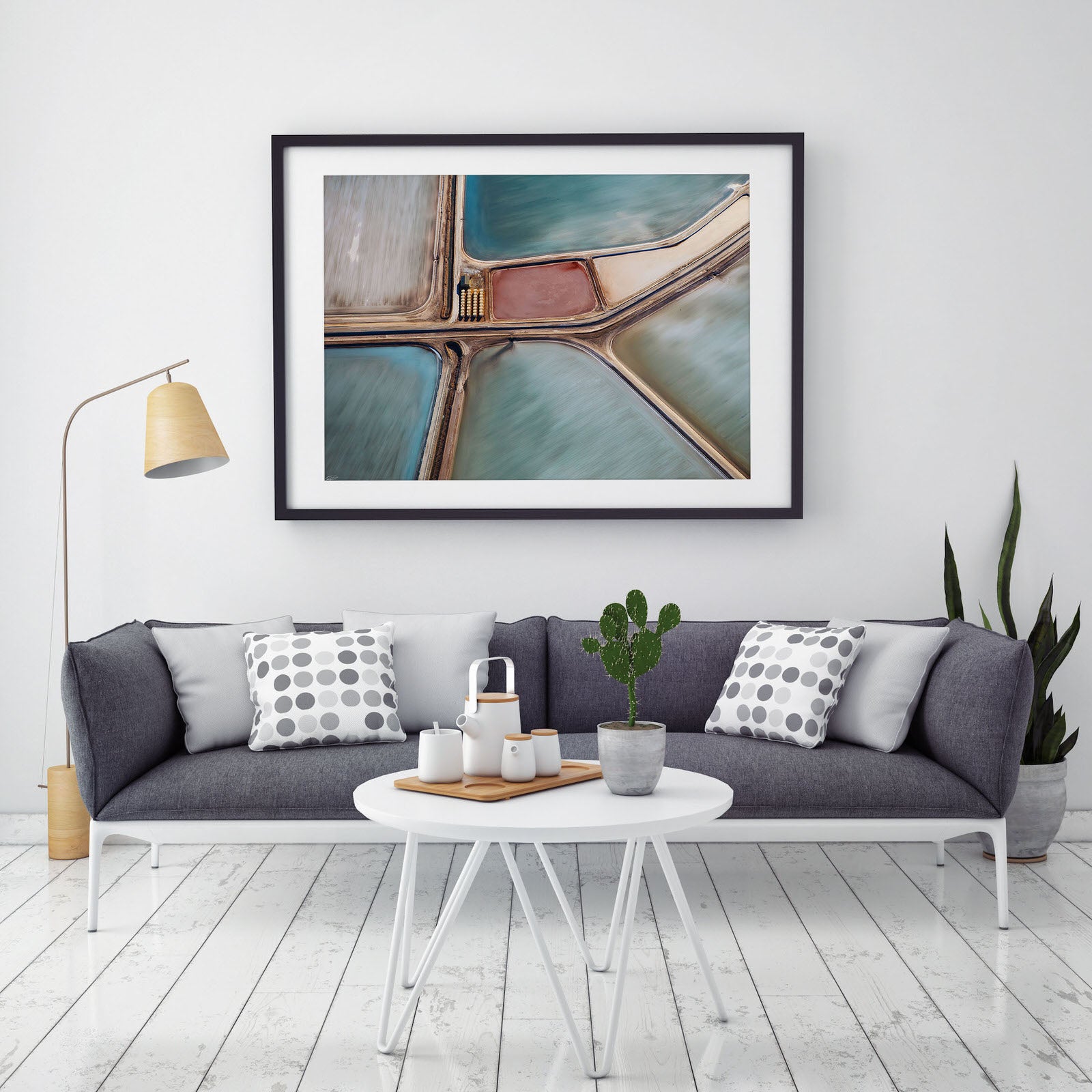 picture hanging on wall abstract art and couch with black frame