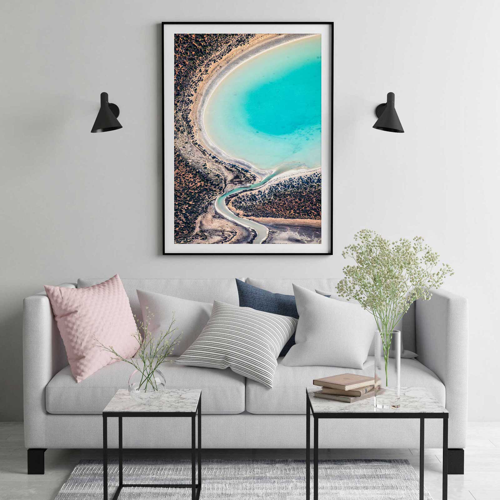 Abstract art and photography hanging on wall in black frame