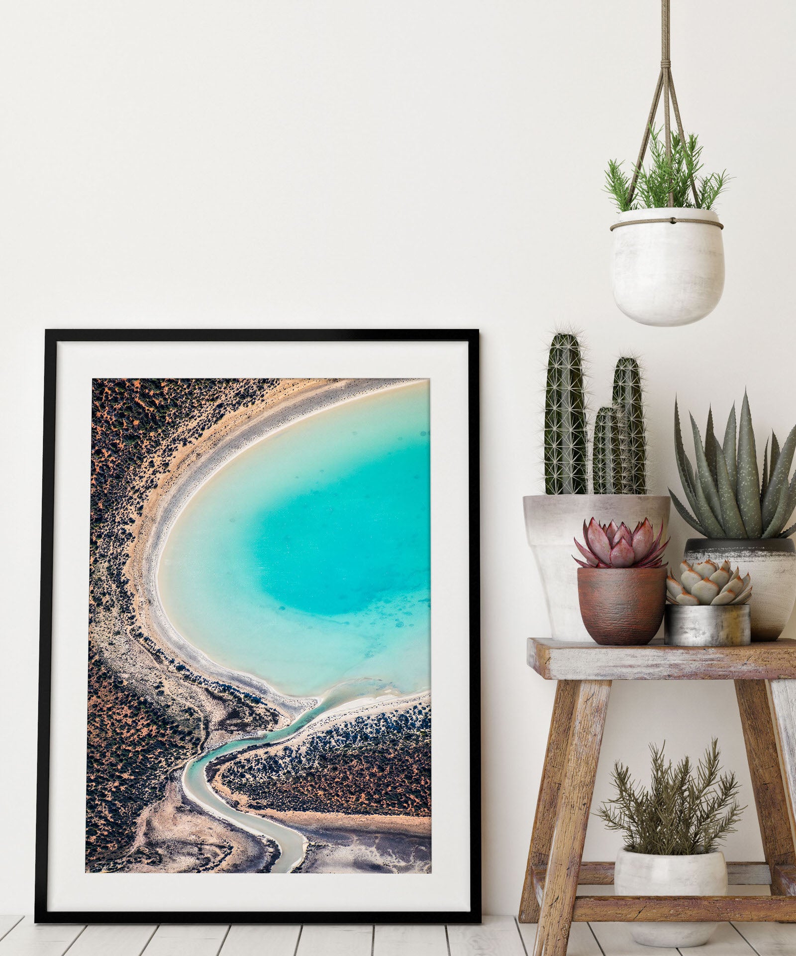 Aerial image of salt pond in Western Australia with blue and red sand