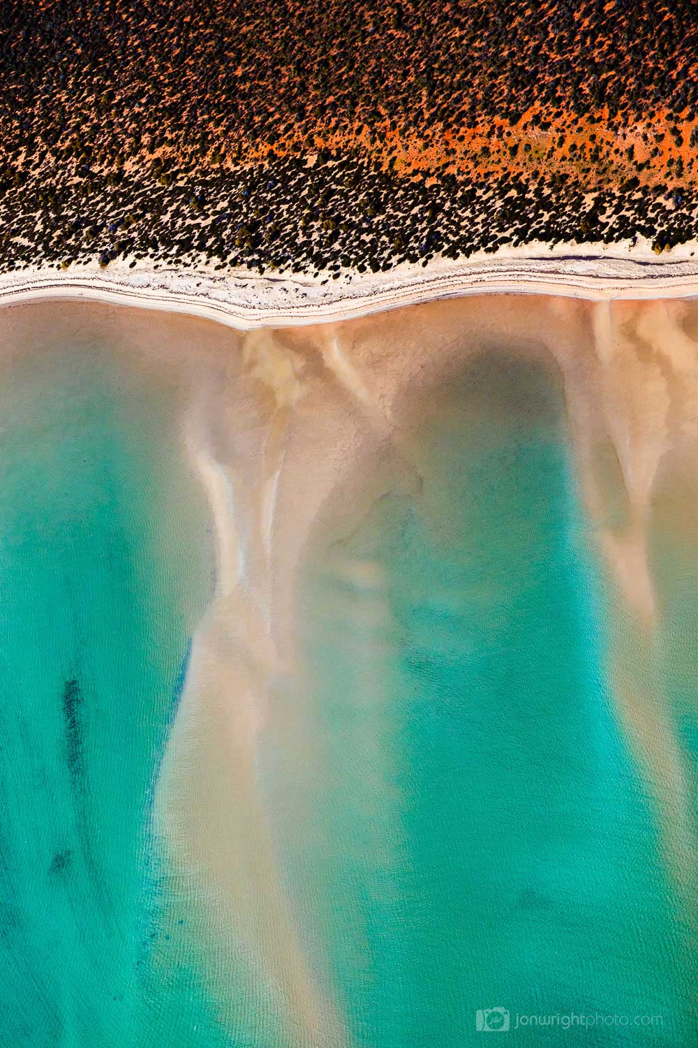 Red and Turquoise aerial abstract image of ocean