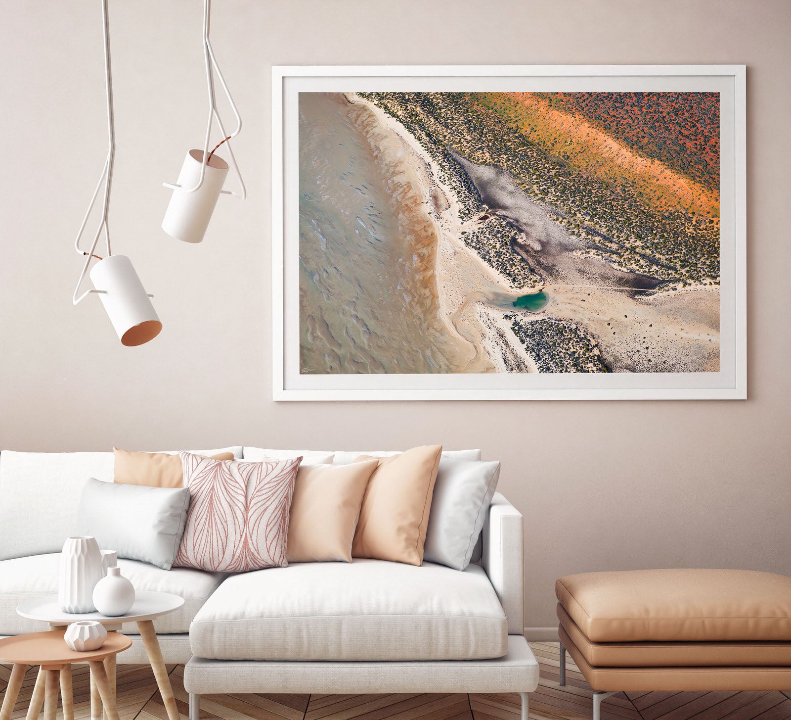 White framed earth tone abstract artwork on wall with pastel colours