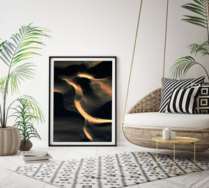 black and gold abstract wall art and print on wall with contemporary styling