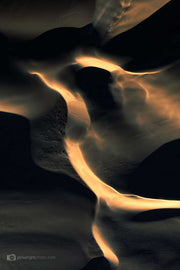 Sand dunes at sunset with dark shadows similar to an eagle