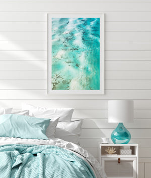 Turqoiuse wall art with white frame of abstract aerial art