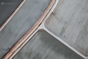 Abstract aerial art and photography of brushed grey salt ponds