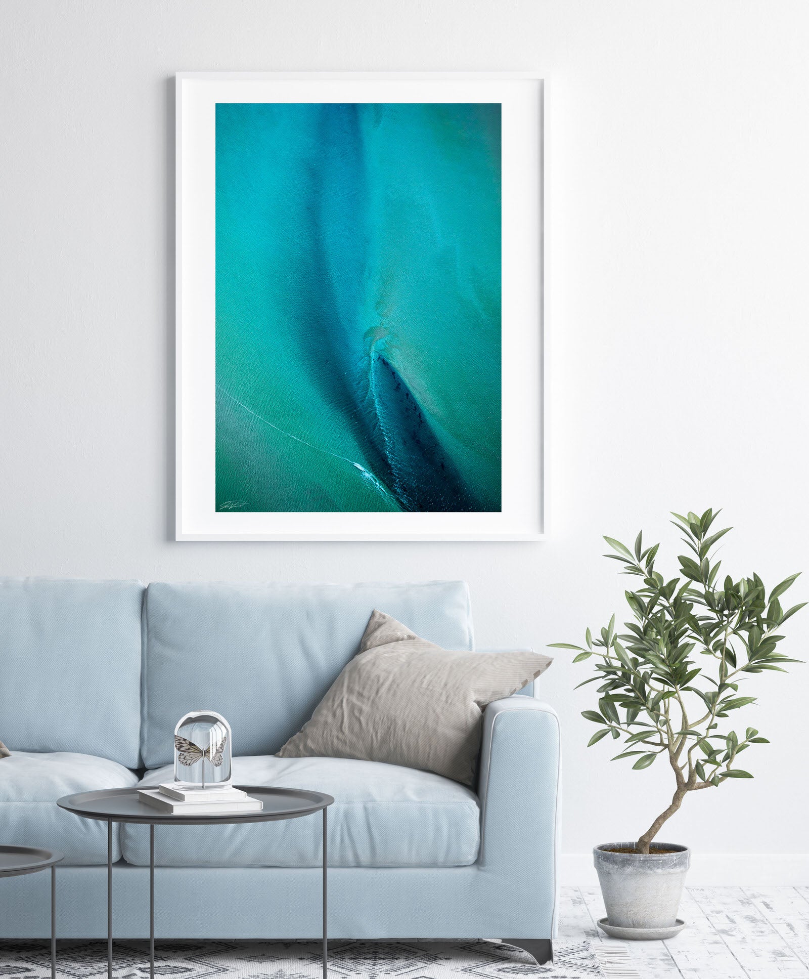 Blue and green abstract aerial wall art in white frame and modern styling