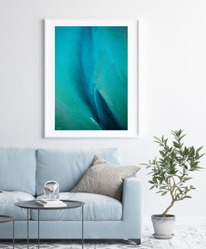 Blue and green abstract aerial wall art in white frame and modern styling