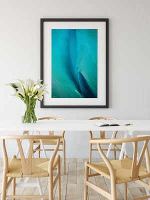 Blue and green abstract aerial wall art in black frame and modern styling